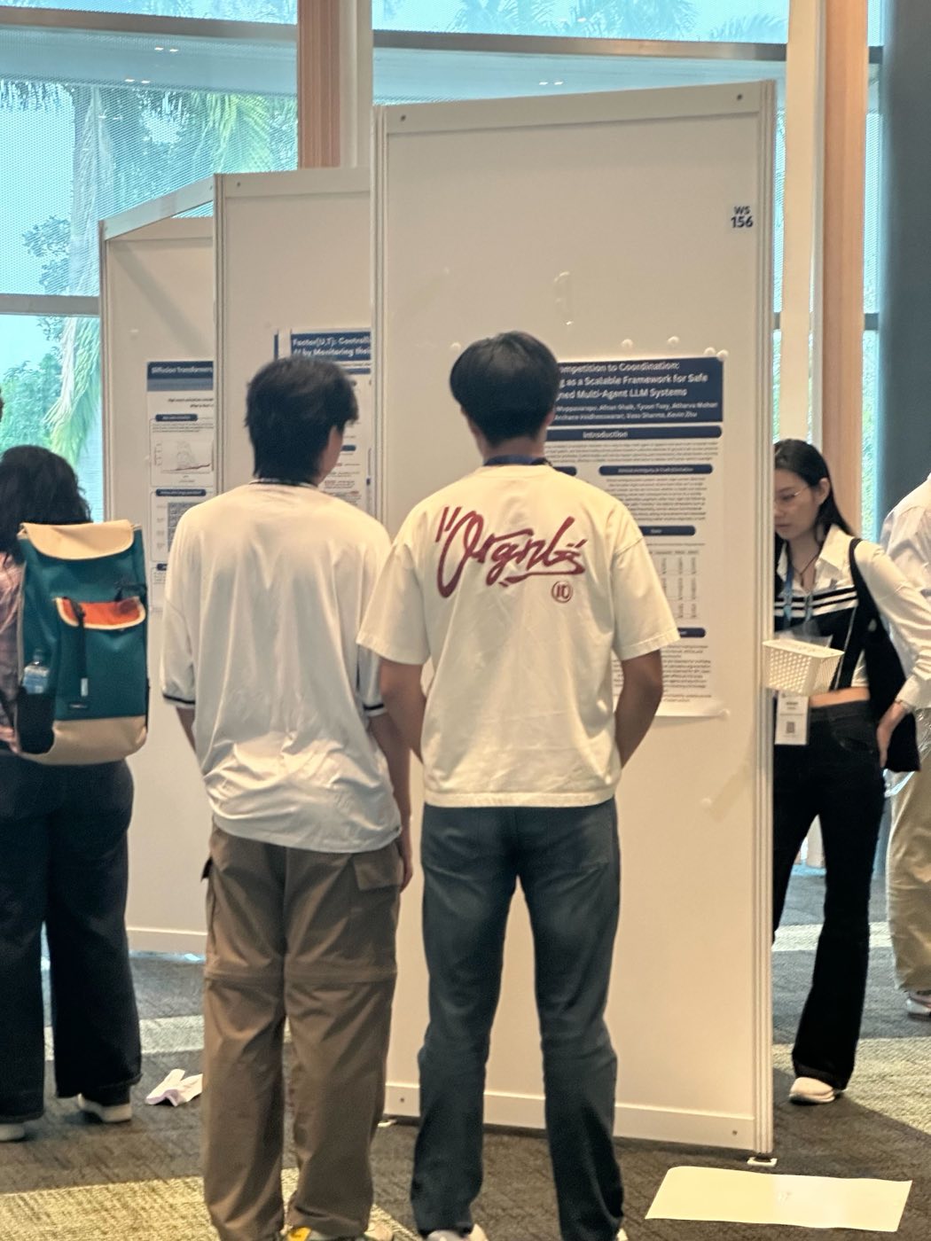 Conference attendees reading Algoverse research posters at AAAI 2026