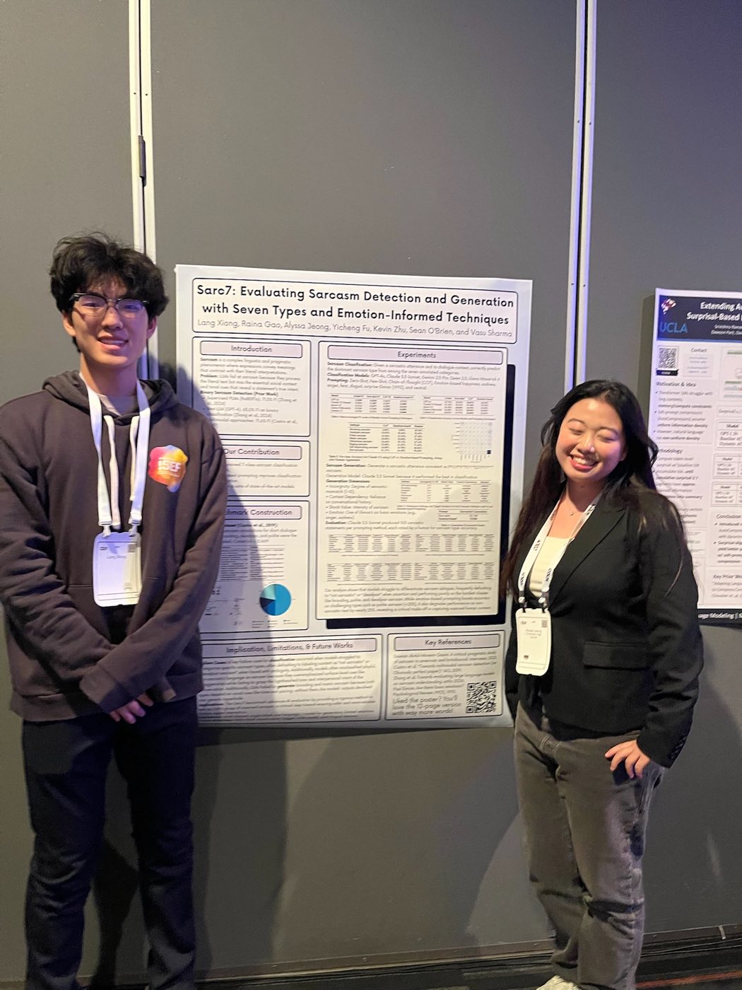 Two Algoverse students presenting sarcasm detection research poster at COLM 2025