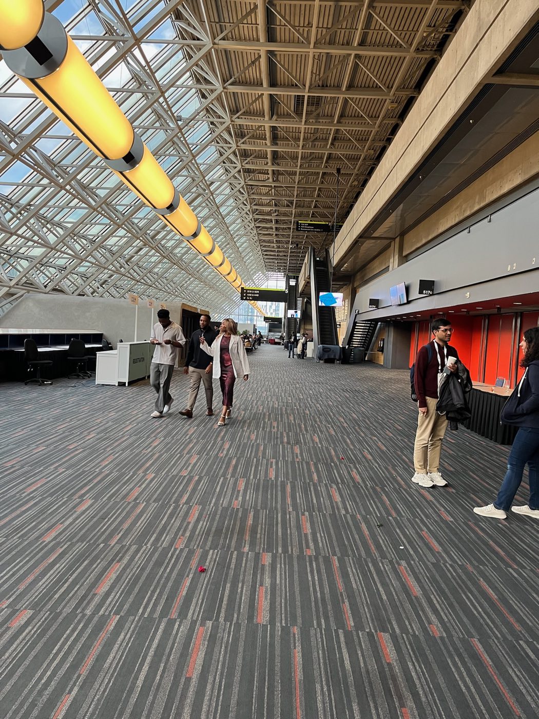 Algoverse attendees walking through the COLM 2025 conference venue