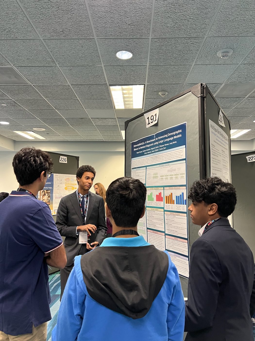 Algoverse student presenting research poster to attendees at EMNLP 2024