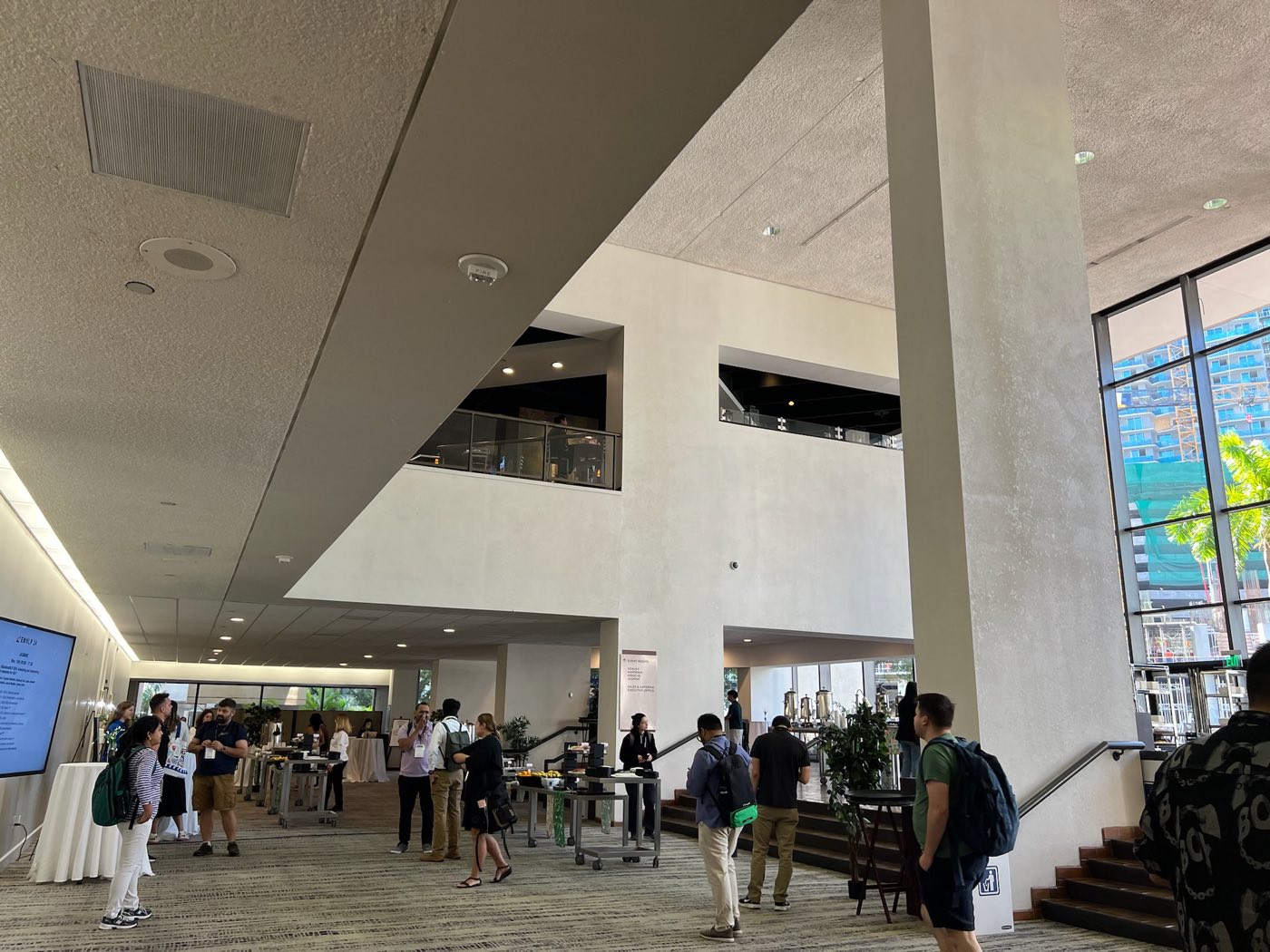 Attendees gathering in the lobby of the EMNLP 2024 venue in Miami