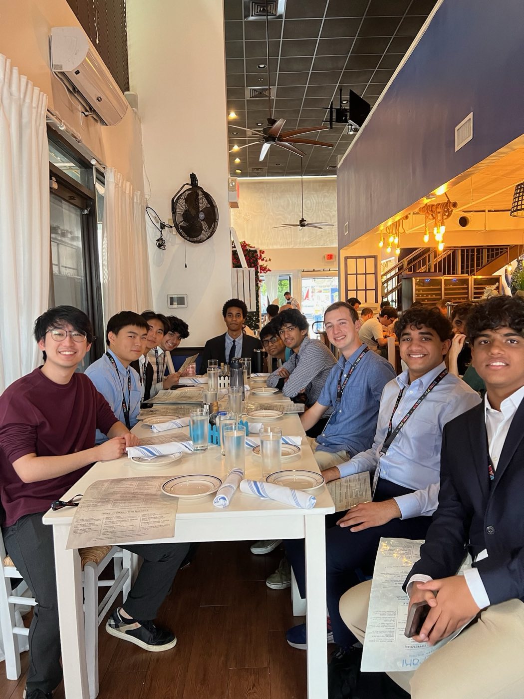 Algoverse students gathered for a team dinner