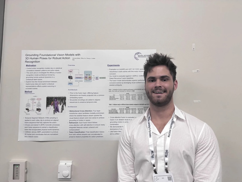 Student presenting Vision Models research poster