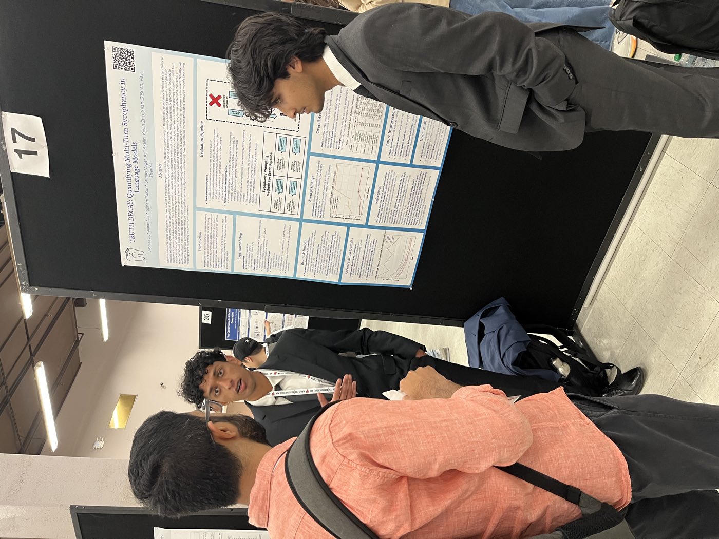 Algoverse student presenting research poster to attendee at NAACL 2025