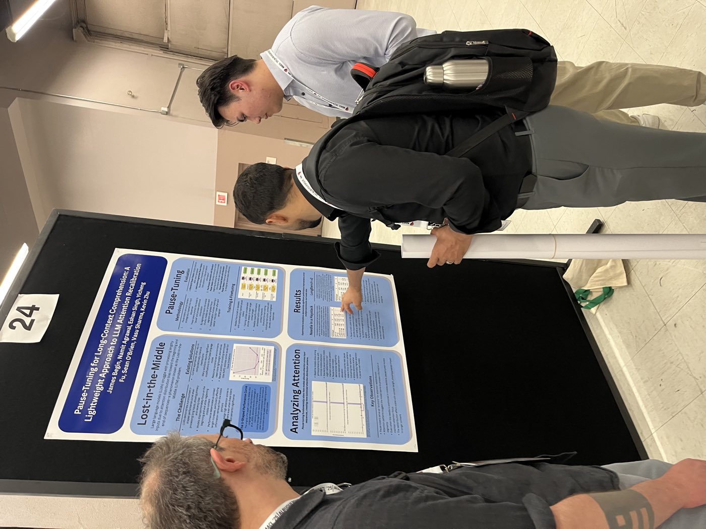 Algoverse students discussing attention research poster at NAACL 2025