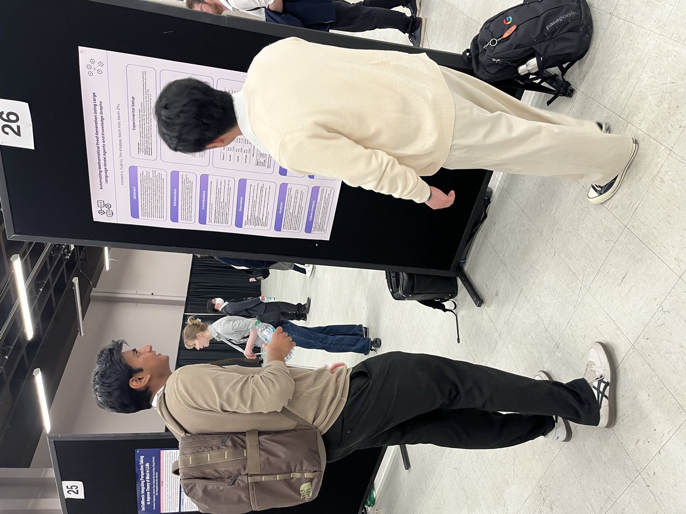 Algoverse student standing beside research poster at NAACL 2025