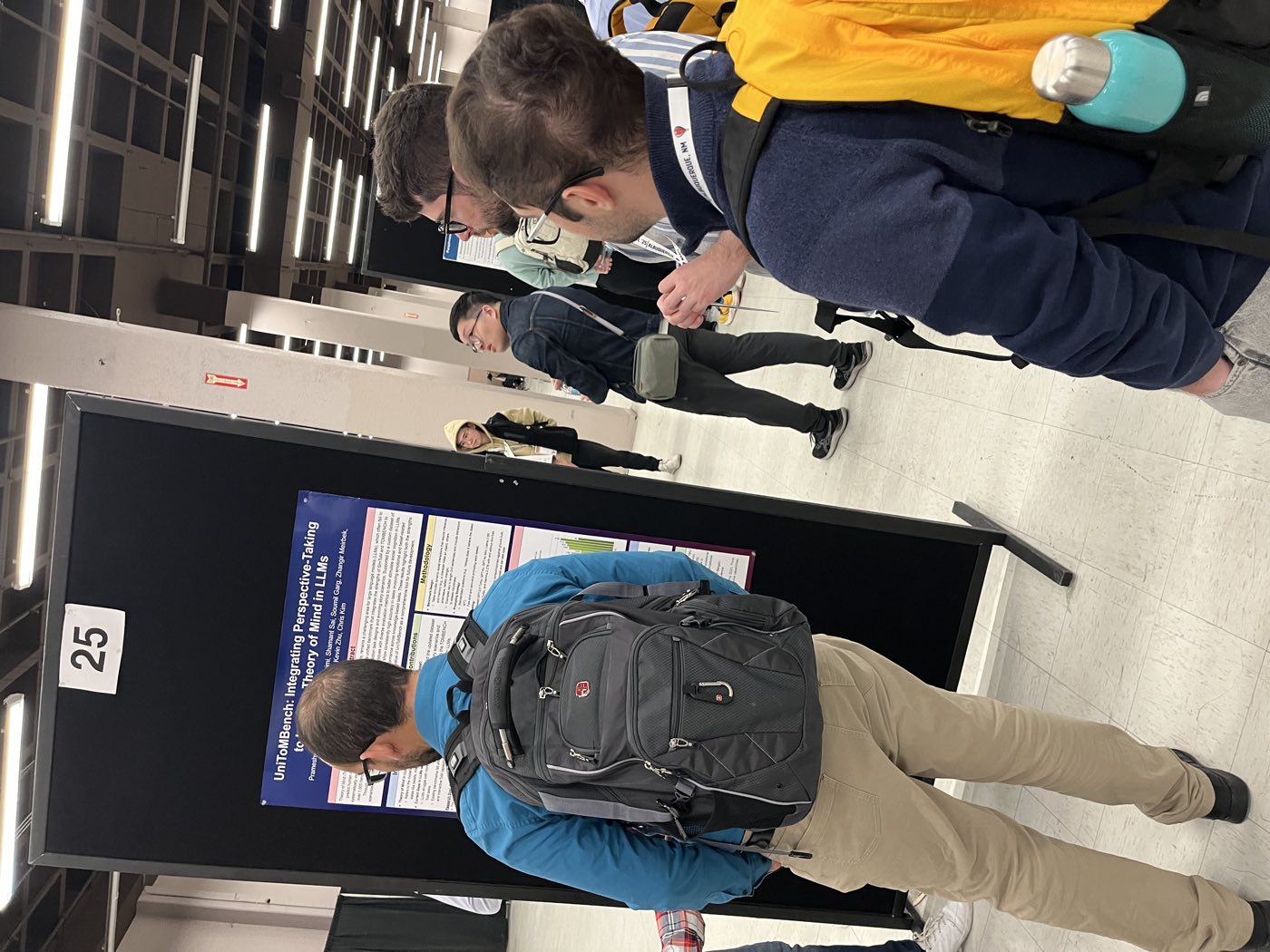 Attendees viewing an Algoverse research poster at NAACL 2025