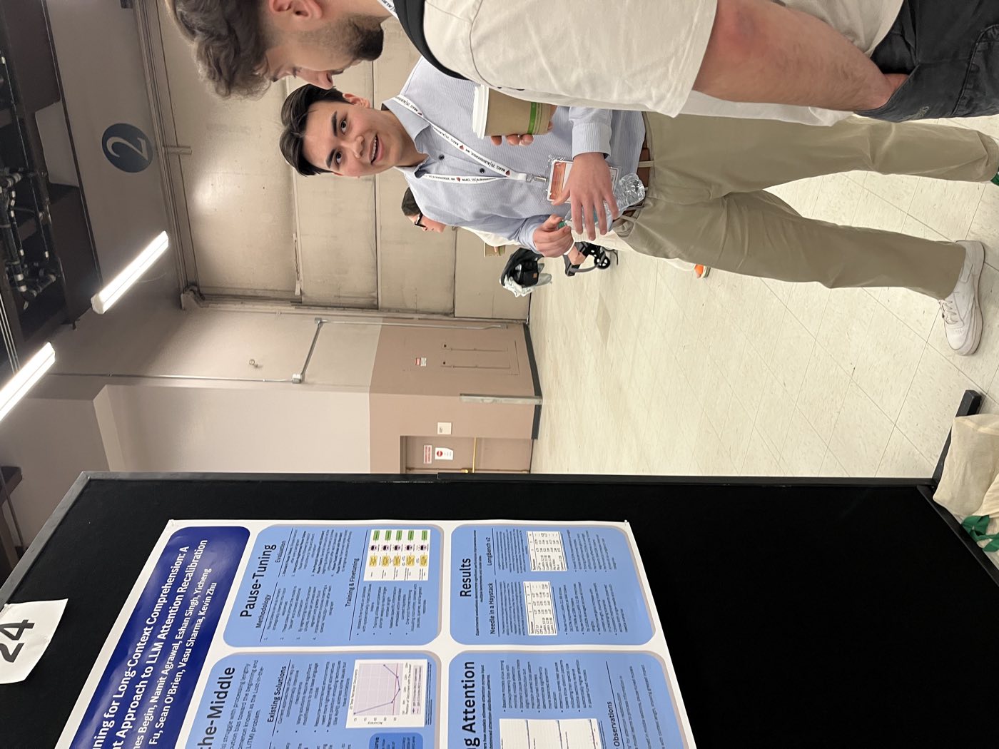 Two Algoverse students standing beside their attention research poster at NAACL 2025