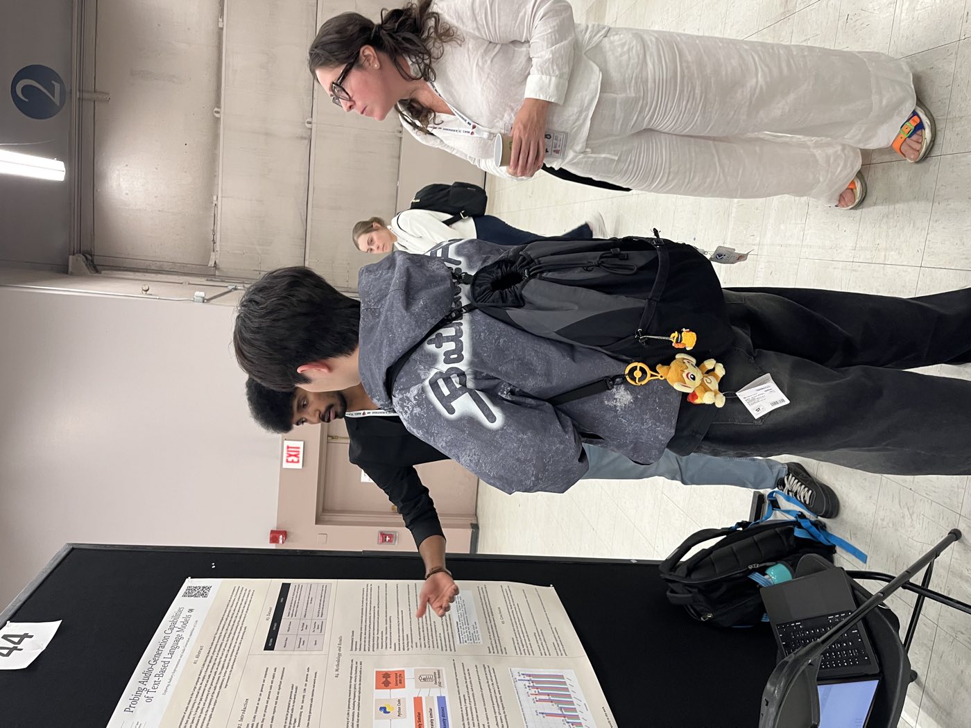 Algoverse student presenting research poster to a NAACL 2025 attendee
