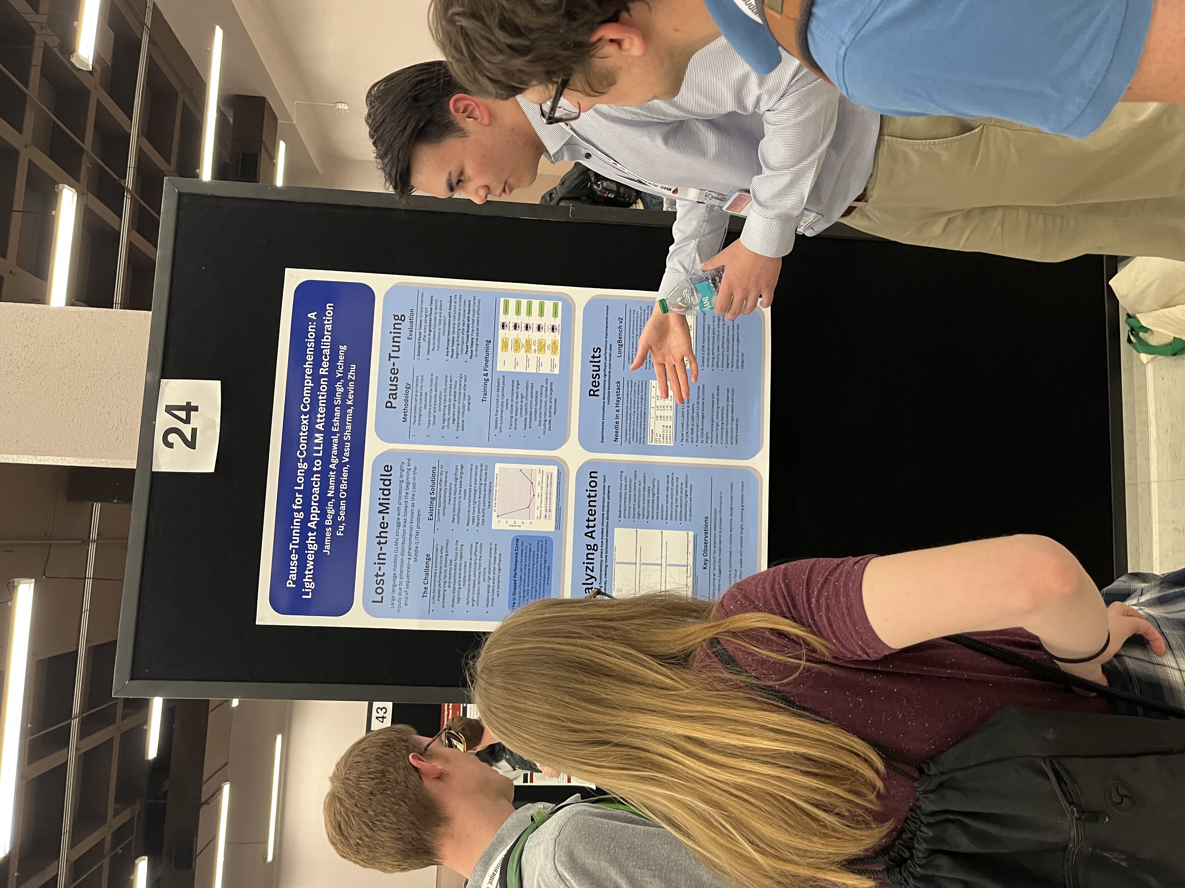 Students presenting Pause-Tuning research poster